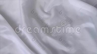 美丽的白色丝绸织物，披着小褶皱，轻柔流动，奢华，婚礼的概念，质地，背景，形式